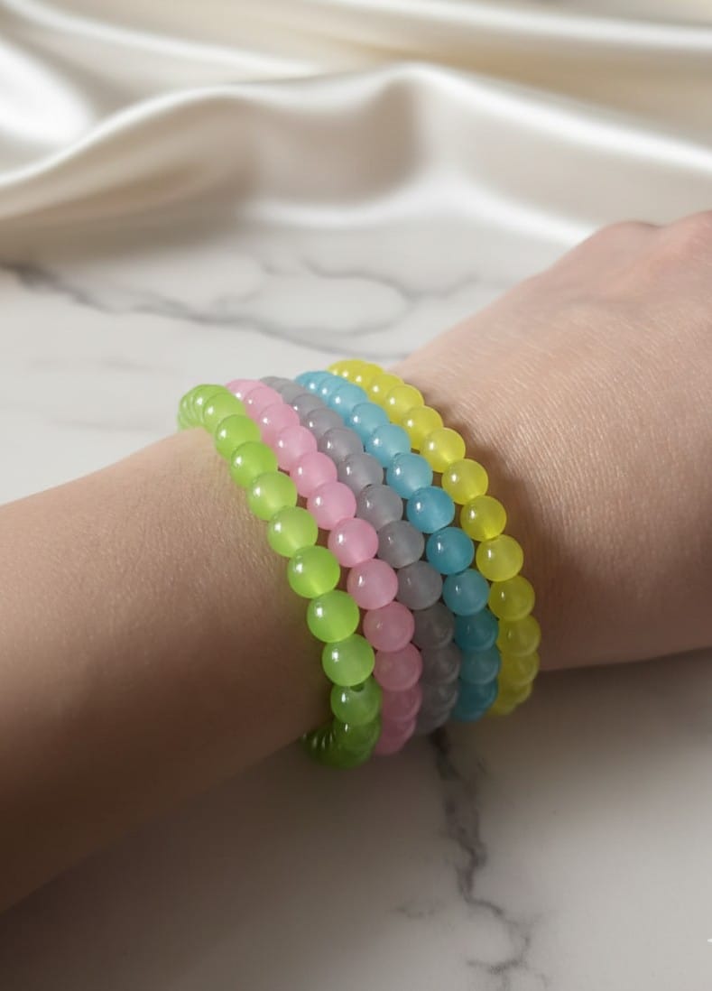 Pastel beaded bracelet stack with colorful translucent beads