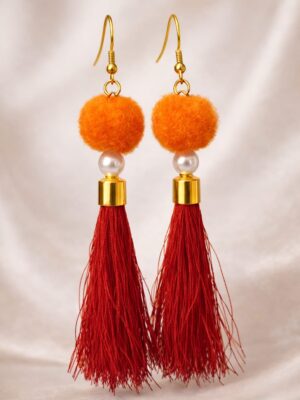Orange tassel pom pom earrings with pearl bead and gold accents