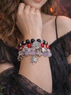 Red and black charm bracelet stack with crystal beads