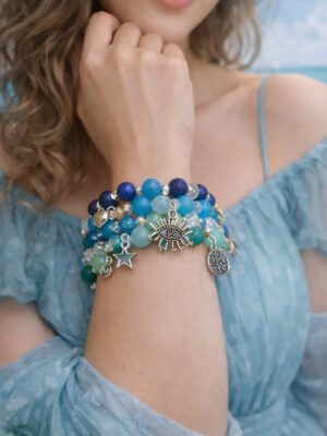 Blue beaded charm bracelet with crystal beads and celestial charms