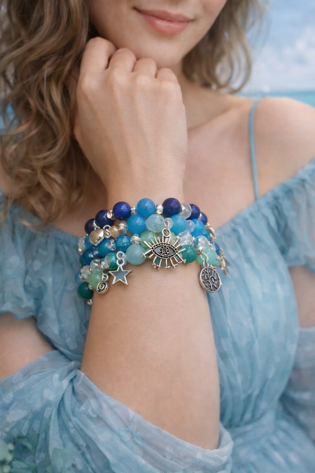 Blue beaded charm bracelet with crystal beads and celestial charms
