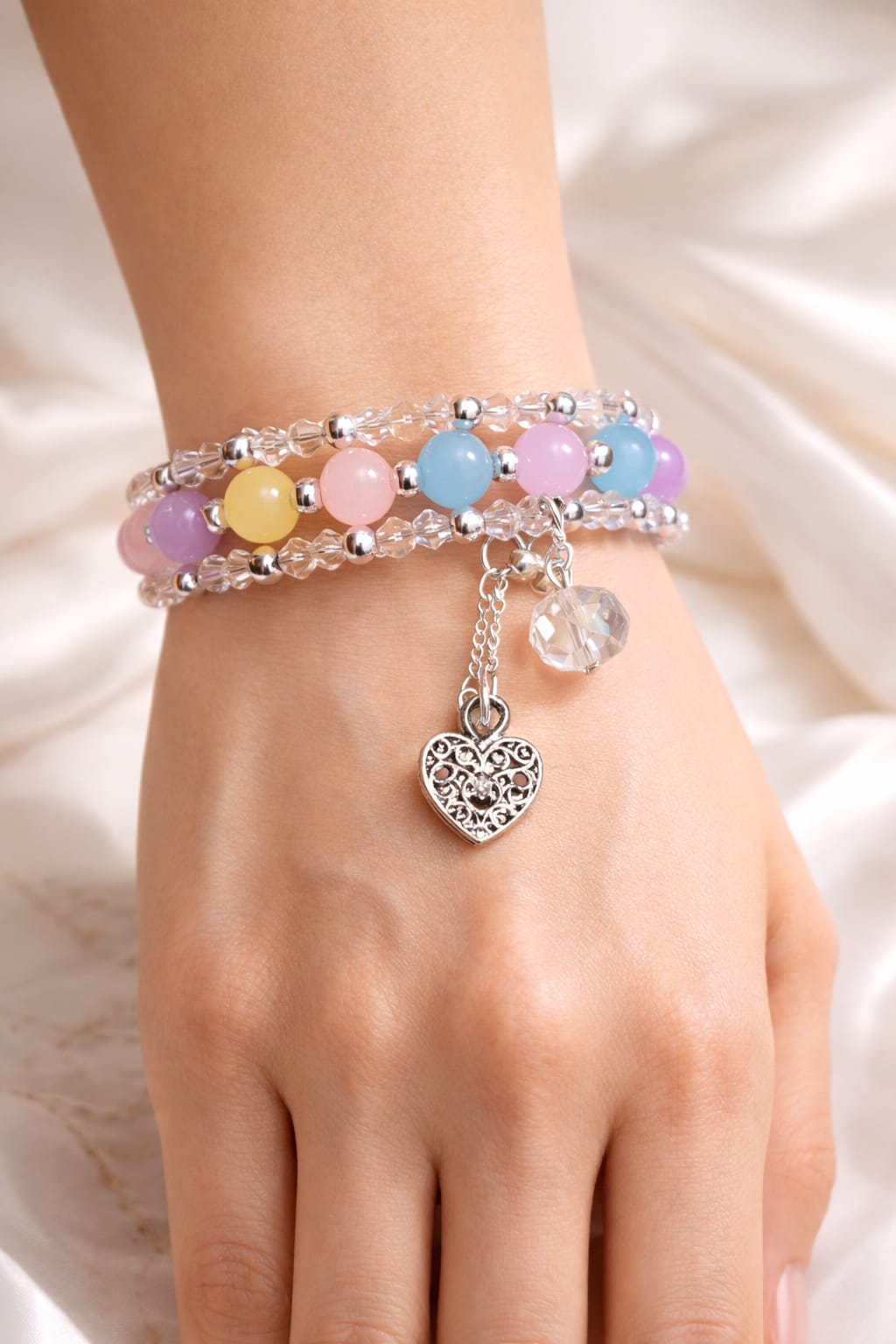 Cute beaded bracelet with pastel beads and charm