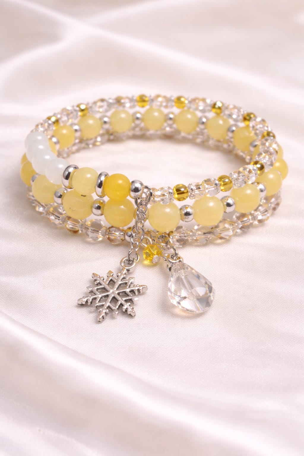 Golden Snow yellow crystal glass bead wrap bracelet with silver snowflake charm, winter festive jewelry for women.