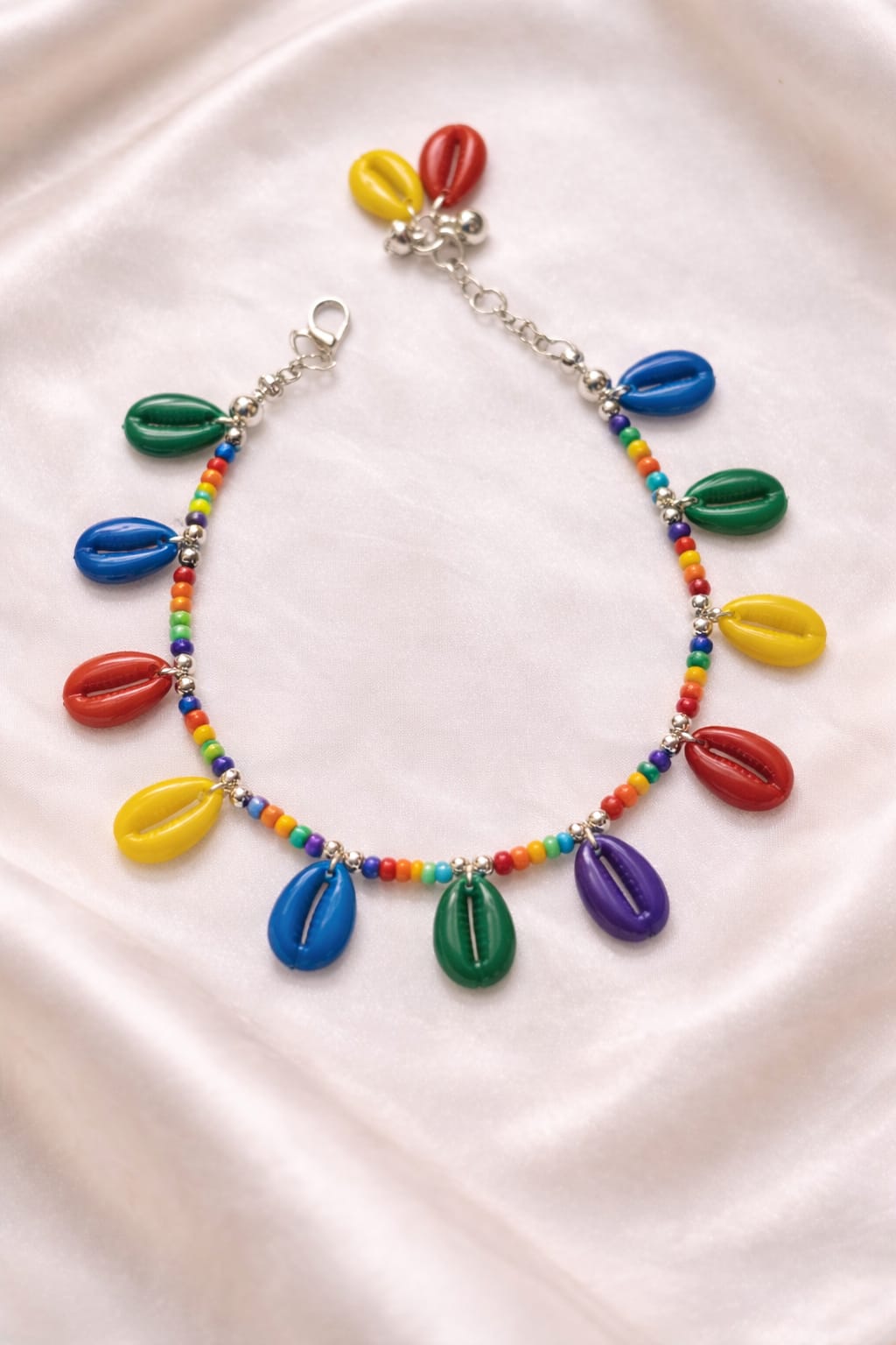 Boho festival anklet with vibrant glass beads and cowrie shells