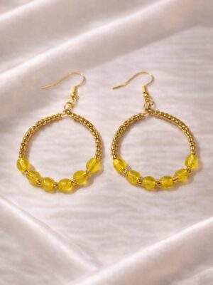 Yellow hoop earrings with gold beads