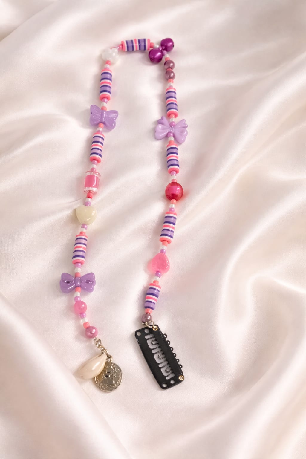 Cute pink hair extension with butterfly charms