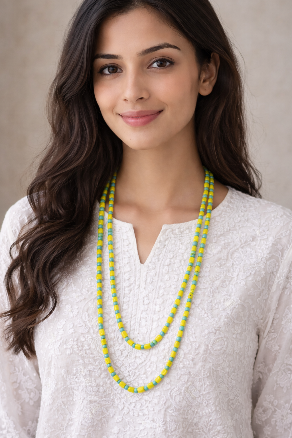 Double-layered blue and yellow beaded necklace styled for summer